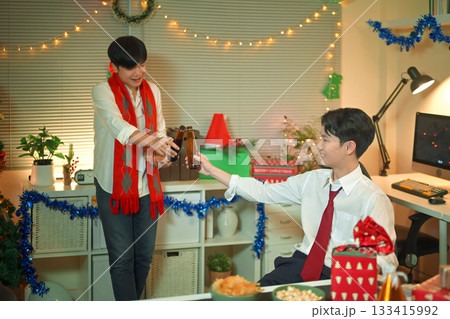 Business people are celebrating holiday in modern office drinking beer and having fun in co working. Merry Christmas and Happy New Year Business people are celebrating holiday in modern office drinking beer and having fun in co working. Merry Christmas and Happy New Year 133415992