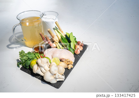 Close up to ingredients set of thai food, Coconut milk with chicken soup.The ingredients are chicken vegetable and many types of herbs toghether combine as a great dish. Close up to ingredients set of thai food, Coconut milk with chicken soup.The ingredients are chicken vegetable and many types of herbs toghether combine as a great dish. 133417425