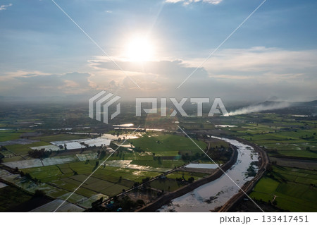 Construction dredges up for a canal and dam, to prevent a flood in the rainy season. Date on 14 May 2021 at Uthai Thani province, Thailand. 133417451
