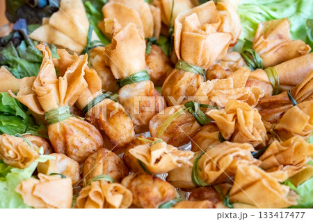 Thung thong is Thai fried bag dumplings made from pork and vegetables that are wrapped in dumplings and deep fried. Thung thong is Thai fried bag dumplings made from pork and vegetables that are wrapped in dumplings and deep fried. 133417477