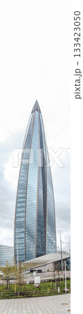 Lakhta Center stands tall as a symbol of innovation in Saint Petersburg, showcasing its unique design against a backdrop of overcast skies. 133423050