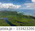 Green hills and small islands along the mangrove coast under a cloudy sky. Siargao, Philippines. 133423266