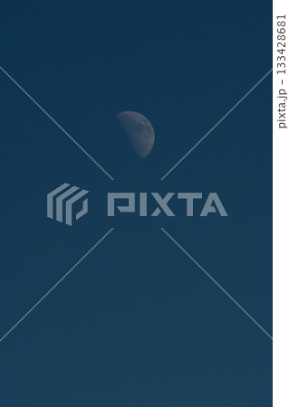 A crescent moon against a dark blue sky. A crescent moon against a dark blue sky. 133428681
