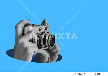 Woman taking retro photos. Digital collage with female hands holding vintage camera. Pop art design. 133430198