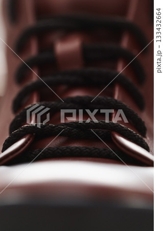 Closeup detail shot of brown leather sneaker Closeup detail shot of brown leather sneaker 133432664