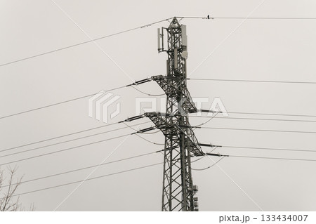 high voltage pole with power line 133434007