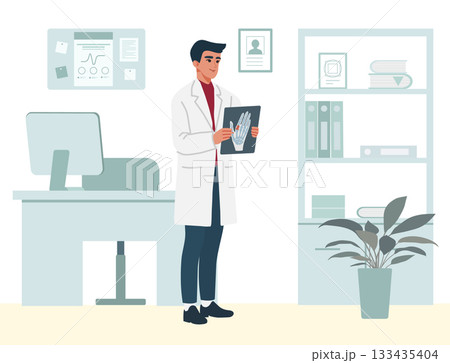 Doctor examining x-ray in modern office setting with computer and plant background 133435404