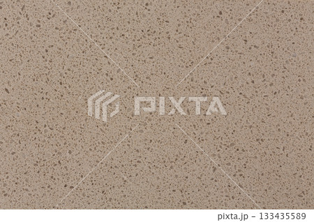 Artificial beige stone detail with vignette. Can be used as background in art or design projects. Artificial beige stone detail with vignette. Can be used as background in art or design projects. 133435589
