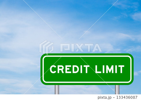 Green color transportation sign with word credit limit on blue sky with white cloud background 133436087