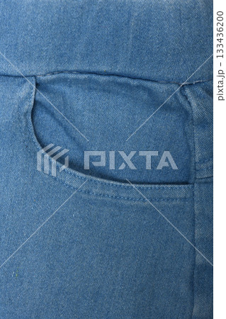 Blue front jeans pocket, old jeans close-up. Fashion concept, business, shopping, sale. Blue front jeans pocket, old jeans close-up. Fashion concept, business, shopping, sale. 133436200