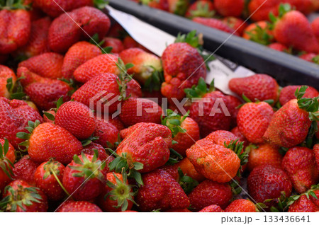 Fresh strawberries collected in a vibrant market showcasing the joys of summer harvest 133436641