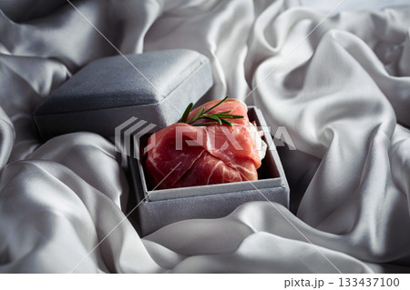 Prosciutto with rosemary in a gray gift box. 133437100