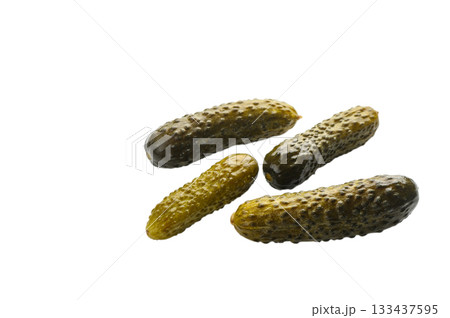 Four barrel-salted cucumbers on white background 133437595