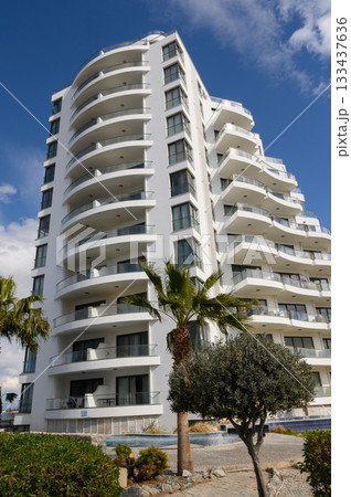 Modern architectural beauty shines under vivid blue skies at a coastal retreat, showcasing elegance and tranquility in design Modern architectural beauty shines under vivid blue skies at a coastal retreat, showcasing elegance and tranquility in design 133437636
