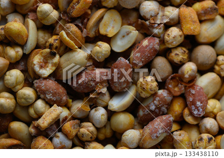 Colorful assortment of roasted nuts and seeds creating a vibrant mosaic of textures and flavors in a casual dining atmosphere Colorful assortment of roasted nuts and seeds creating a vibrant mosaic of textures and flavors in a casual dining atmosphere 133438110