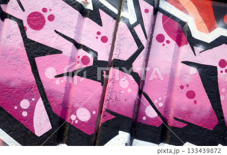 Colorful background of graffiti painting artwork with bright aerosol outlines on wall. Old school street art piece made with aerosol spray paint cans. Contemporary youth culture backdrop Colorful background of graffiti painting artwork with bright aerosol outlines on wall. Old school street art piece made with aerosol spray paint cans. Contemporary youth culture backdrop 133439872