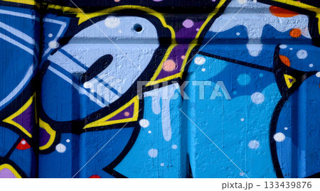 Colorful background of graffiti painting artwork with bright aerosol outlines on wall. Old school street art piece made with aerosol spray paint cans. Contemporary youth culture backdrop Colorful background of graffiti painting artwork with bright aerosol outlines on wall. Old school street art piece made with aerosol spray paint cans. Contemporary youth culture backdrop 133439876