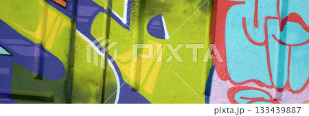 Colorful background of graffiti painting artwork with bright aerosol outlines on wall. Old school street art piece made with aerosol spray paint cans. Contemporary youth culture backdrop Colorful background of graffiti painting artwork with bright aerosol outlines on wall. Old school street art piece made with aerosol spray paint cans. Contemporary youth culture backdrop 133439887