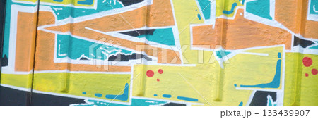 Colorful background of graffiti painting artwork with bright aerosol outlines on wall. Old school street art piece made with aerosol spray paint cans. Contemporary youth culture backdrop Colorful background of graffiti painting artwork with bright aerosol outlines on wall. Old school street art piece made with aerosol spray paint cans. Contemporary youth culture backdrop 133439907