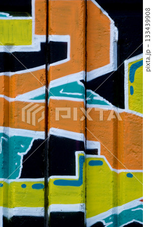 Colorful background of graffiti painting artwork with bright aerosol outlines on wall. Old school street art piece made with aerosol spray paint cans. Contemporary youth culture backdrop Colorful background of graffiti painting artwork with bright aerosol outlines on wall. Old school street art piece made with aerosol spray paint cans. Contemporary youth culture backdrop 133439908