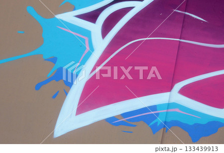 Colorful background of graffiti painting artwork with bright aerosol outlines on wall. Old school street art piece made with aerosol spray paint cans. Contemporary youth culture backdrop Colorful background of graffiti painting artwork with bright aerosol outlines on wall. Old school street art piece made with aerosol spray paint cans. Contemporary youth culture backdrop 133439913