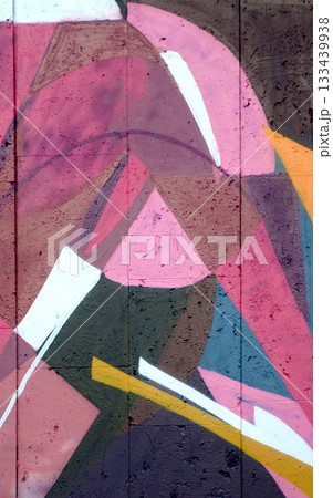 Colorful background of graffiti painting artwork with bright aerosol outlines on wall. Old school street art piece made with aerosol spray paint cans. Contemporary youth culture backdrop 133439938