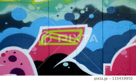 Colorful background of graffiti painting artwork with bright aerosol outlines on wall. Old school street art piece made with aerosol spray paint cans. Contemporary youth culture backdrop Colorful background of graffiti painting artwork with bright aerosol outlines on wall. Old school street art piece made with aerosol spray paint cans. Contemporary youth culture backdrop 133439950