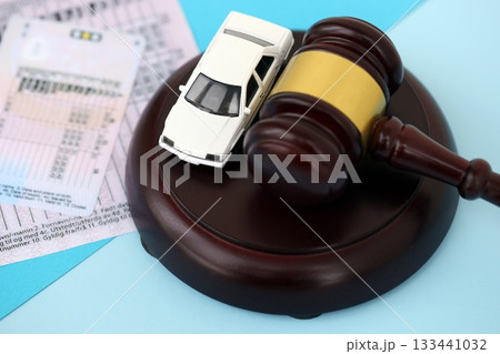 Generic driving license and judge hammer on blue background close up 133441032