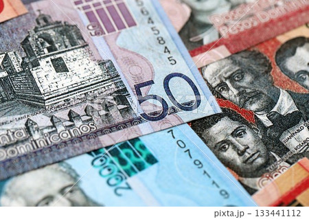 Dominican Republic Pesos currency money bills. DOP currency banknotes in stack with different denomination close up Dominican Republic Pesos currency money bills. DOP currency banknotes in stack with different denomination close up 133441112