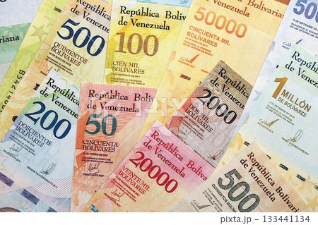 Venezuelan Bolivar currency money bills in big amount. Pile of VED currency banknotes with different denomination close up 133441134