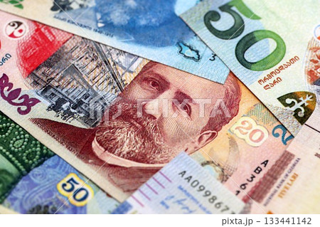 Georgian Lari currency money bills. GEL currency banknotes in pile with different denomination close up Georgian Lari currency money bills. GEL currency banknotes in pile with different denomination close up 133441142