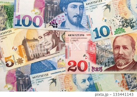 Georgian Lari currency money bills in heap. GEL currency banknotes with different denomination close up Georgian Lari currency money bills in heap. GEL currency banknotes with different denomination close up 133441143
