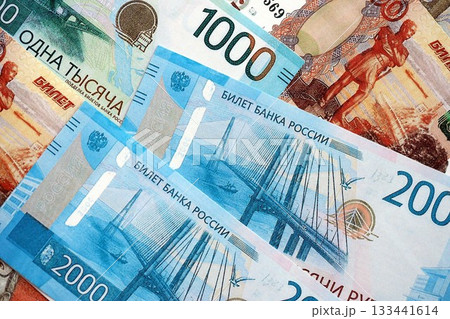 Russian ruble money bills banknotes lies in big pile on table close up. Concept of finances and business in Russian Federation 133441614