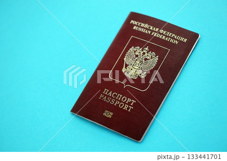 Russian Federation red passport on light blue table background close up. Concept of travel and tourism Russian Federation red passport on light blue table background close up. Concept of travel and tourism 133441701