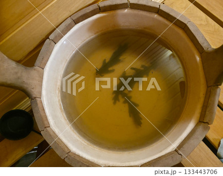 Sauna Bucket with Oak Leaves for Traditional Steam Ritual 133443706