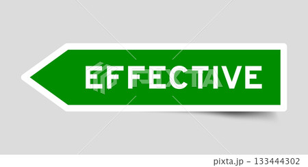 Green color arrow shape sticker label with word effective on gray background 133444302