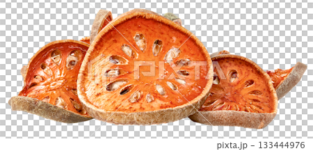 Close-up of dried bael fruit slices against. The orange, circular fruit pieces reveal their texture and seed cavities, suggesting natural ingredients and healthy food preparation. 133444976