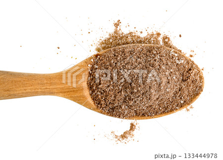 Wooden spoon filled with coarse brown sugar and cocoa powder mixture, scattered, Close-up, top-down view of ingredients for baking or seasoning. Food preparation concept. 133444978