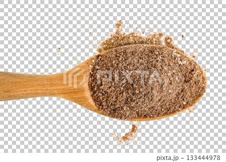 Wooden spoon filled with coarse brown sugar and cocoa powder mixture, scattered, Close-up, top-down view of ingredients for baking or seasoning. Food preparation concept. 133444978