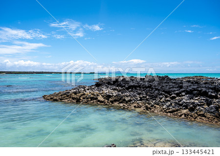 Clear turquoise waters and rocky shore at Santa Cruz Island, Galapagos, Ecuador 133445421
