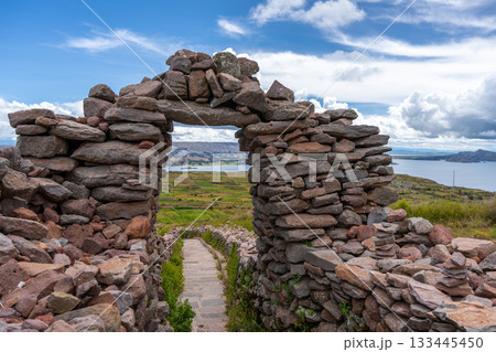 Stone pathway and arch at Pachatata archaeological site, Amantani Island, La ke Titicaca, Peru 133445450