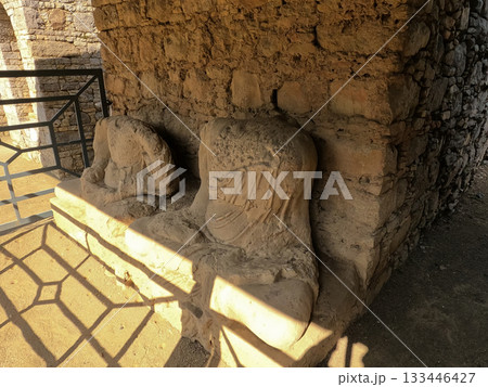 Heritage Ancient headless statues seated in monastery ruins taxila Pakistan 133446427