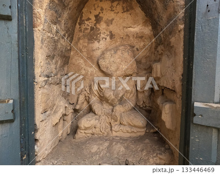 Heritage seated Buddha with surrounding attendant figures in Gandhara monastery Mohra Muradu Taxila Pakistan 133446469