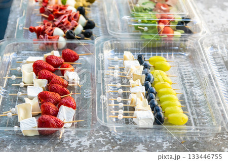 canapes on skewers in plastic containers outdoors canapes on skewers in plastic containers outdoors 133446755
