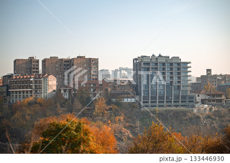 A city skyline with a large building in the middle A city skyline with a large building in the middle 133446930