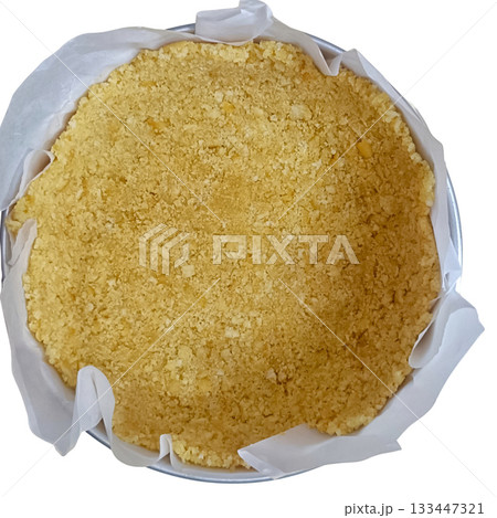 Crumbly shortbread crust in round pan with parchment paper, warm golden texture and homemade feel Crumbly shortbread crust in round pan with parchment paper, warm golden texture and homemade feel 133447321