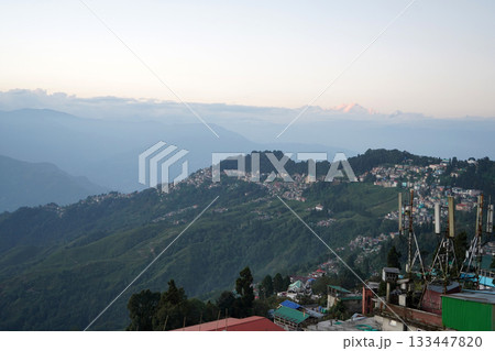 Darjeeling Hill Station Cityscape and Antenna Towers with Distant Kanchenjunga Mountain Peak at Sunset 133447820