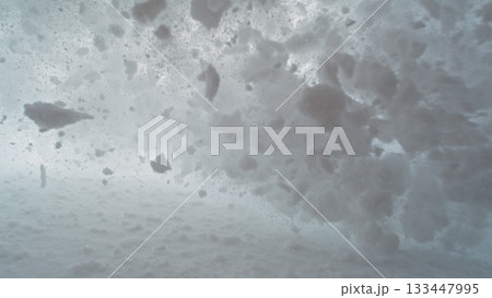 Snow avalanche sliding down a mountainside and crush into camera , freeze motion 133447995