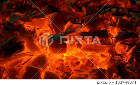 Close-up of Hot Embers with Flying Sparks . Concept of heating grills or ovens 133448071