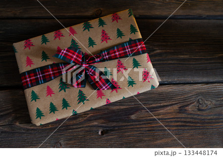 Cozy Christmas Interior with Fireplace, Gift Boxes, and Decorated Tree with Warm Lights Cozy Christmas Interior with Fireplace, Gift Boxes, and Decorated Tree with Warm Lights 133448174
